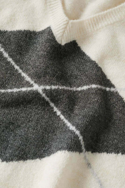 Ecru knit fabric with charcoal argyle diamond pattern and white line details