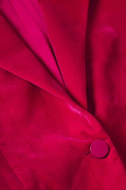 Fuchsia blazer lapel detail with single round button