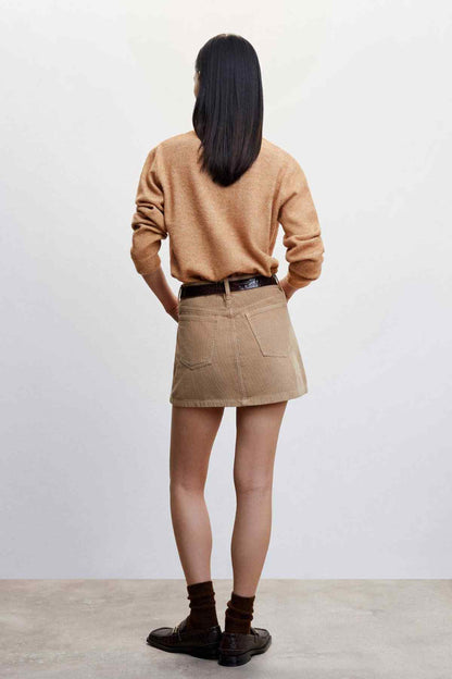 Medium brown back view knit sweater with denim mini skirt