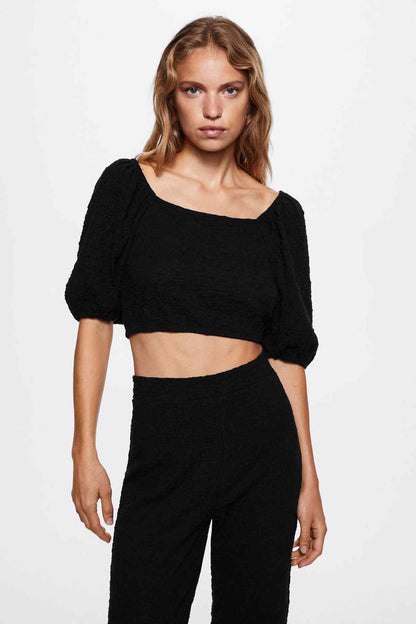 Black high-waist wide-leg trousers with smooth front and relaxed fit