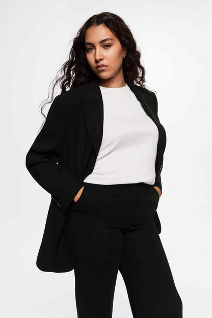 Black blazer with notch lapels, button front, flap pockets, relaxed drape