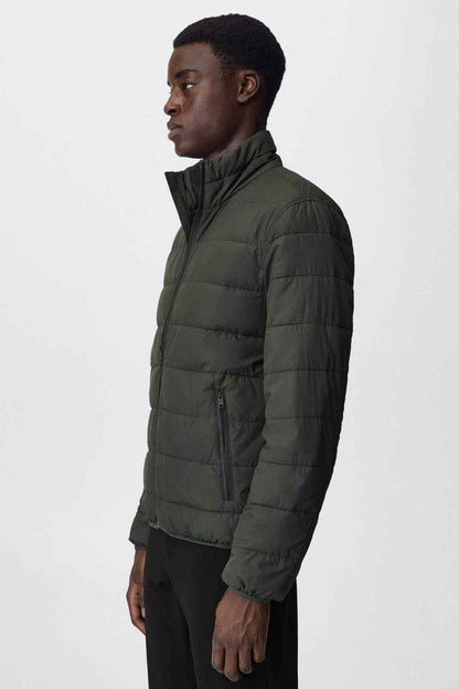 Mango dark olive quilted puffer jacket side view with full zipper and stand collar.