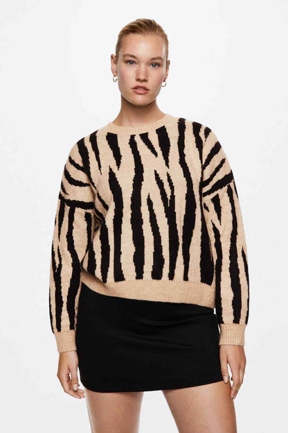 Ecru zebra-print knit sweater with crew neck, long sleeves, ribbed cuffs