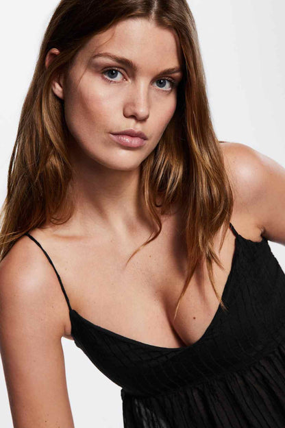 MANGO black camisole top close-up, V-neck and textured pleated bust