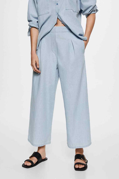 Light blue wide-leg pants with front pleats and slit pockets
