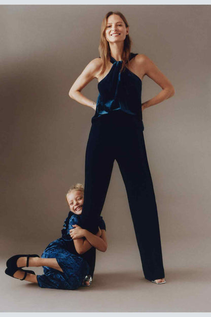 Mango halter-neck velvet top, dark navy, tie neckline on standing model