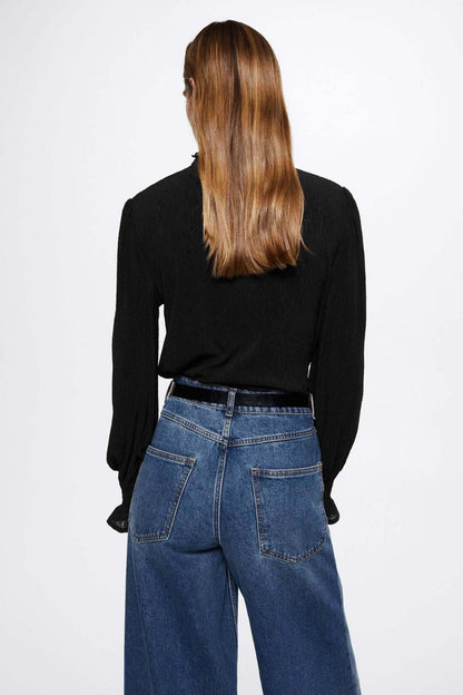 Black long-sleeve blouse with crew neckline and gathered shoulders