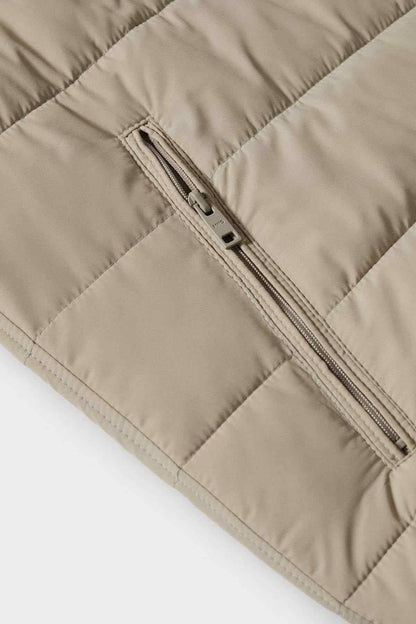 Ice grey puffer vest close-up of double-slider zipper