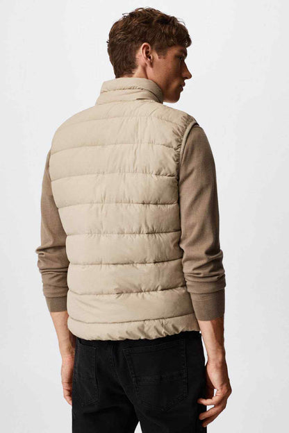 Ice grey puffer vest, back view with quilted baffles and stand collar