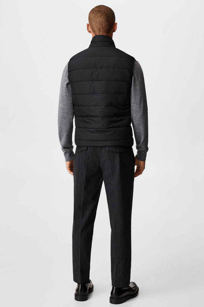 Black padded gilet vest, back view with quilted panels and front zip