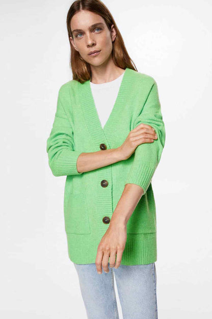 Green knit cardigan with V-neck and button front, patch pockets