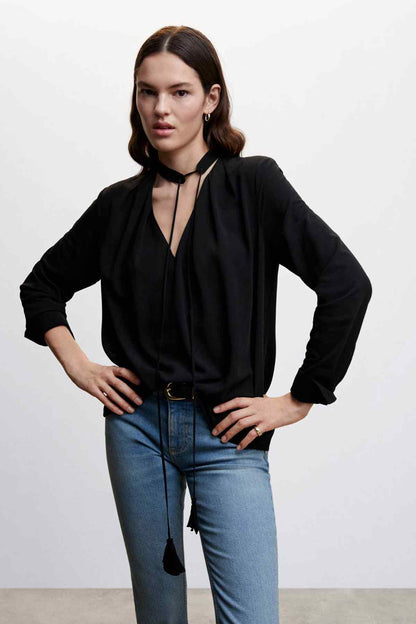 Black blouse with keyhole V neckline and choker-style tie