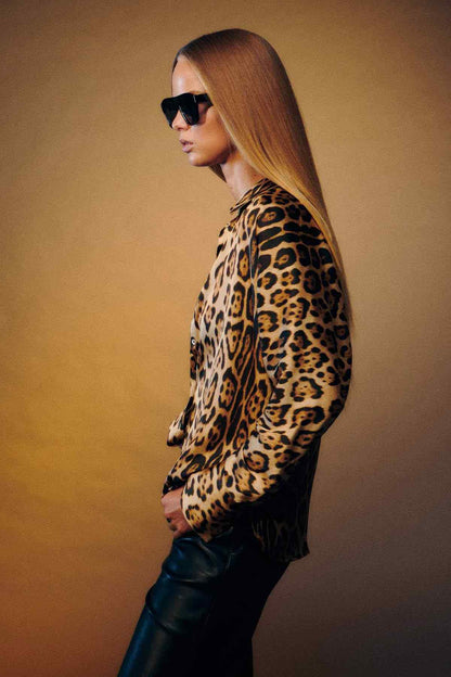 Leopard-print blouse side view with long sleeves and structured shoulder