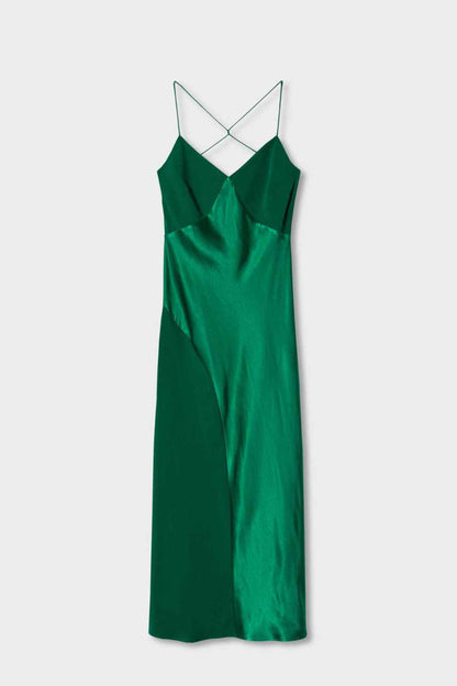 Green satin slip dress laid flat with halter straps and draped skirt