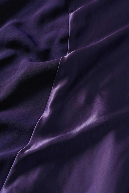 MANGO purple satin fabric close-up with smooth sheen and seam detail