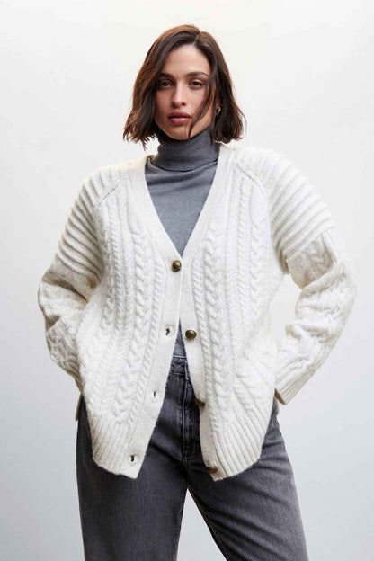 Ecru cable-knit cardigan with V-neck button front and textured knit cuffs