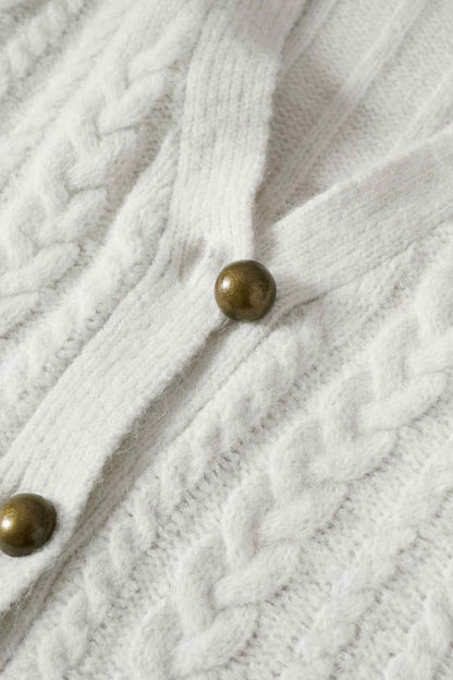 Ecru knitted cardigan front with brass-tone buttons