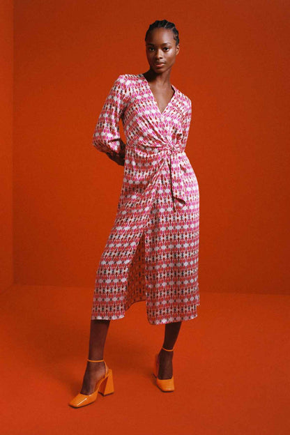 Fuchsia printed wrap midi dress with V-neck, long sleeves, and waist tie