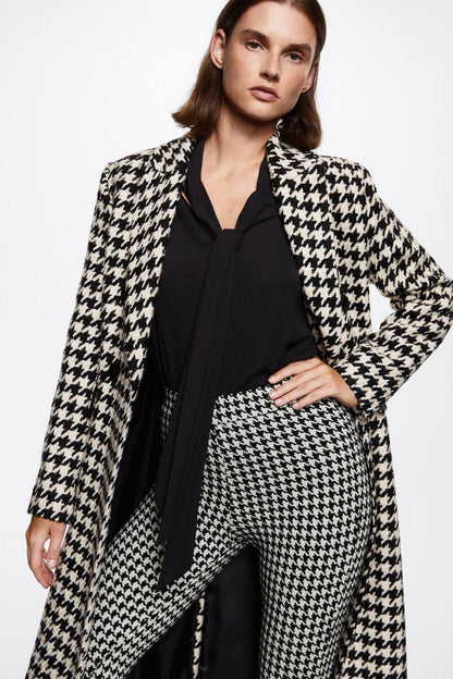 Black-and-white houndstooth trousers with high-rise waistband