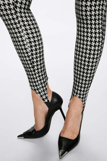 Black-and-white houndstooth slim trousers, cropped hem detail