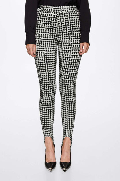 Black-and-white houndstooth trousers, slim ankle-length
