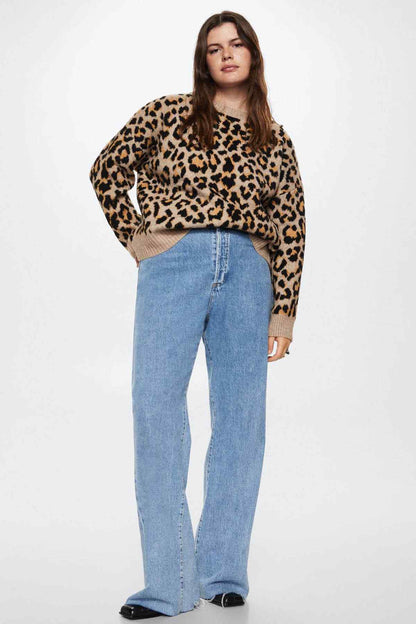 Leopard-print knit sweater with ribbed hem and crew neck, styled with jeans