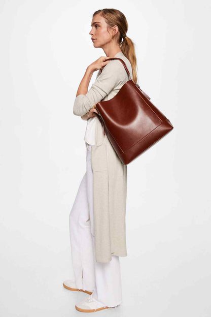 Light pastel grey long cardigan with open front and tie waist, worn over white pants