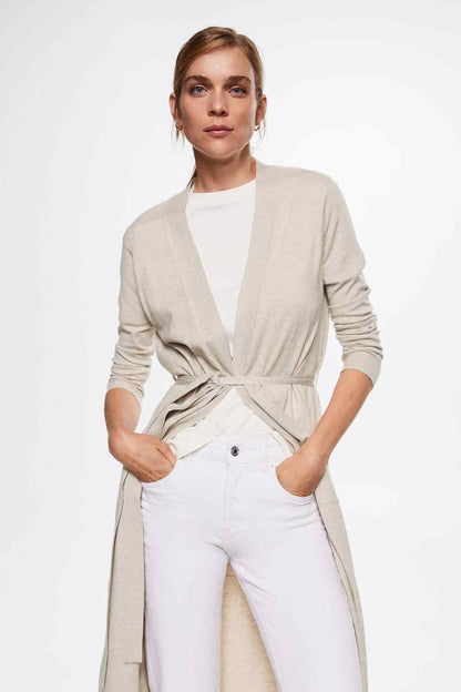 Light pastel grey long cardigan with open front and tie waist over a white top