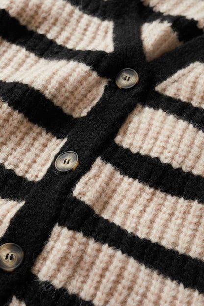 Striped knit cardigan close-up: black and sand stripes with button placket