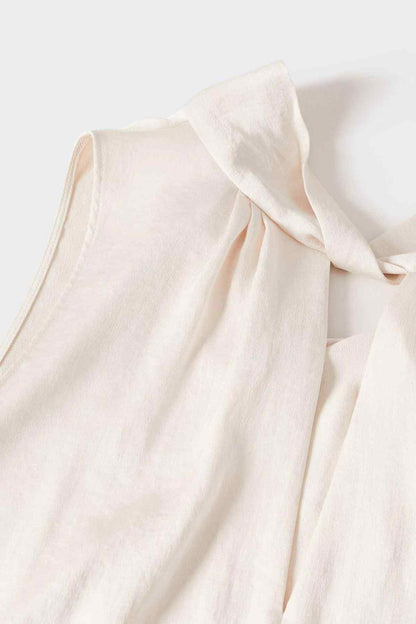Ecru sleeveless blouse fabric with gathered drape and neckline cutout