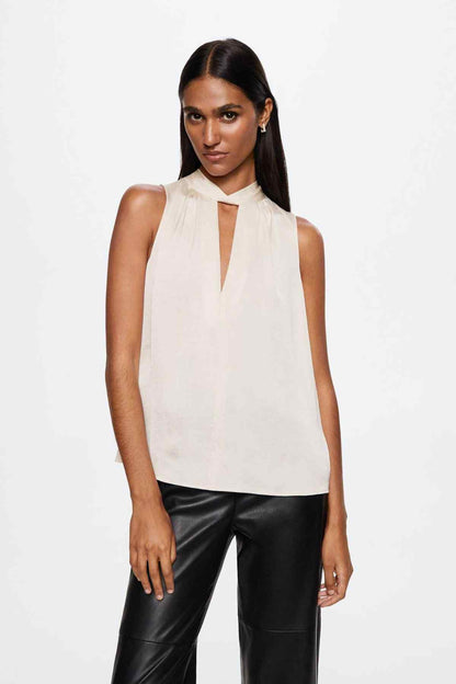 Ecru sleeveless blouse with V-keyhole neckline and tie detail