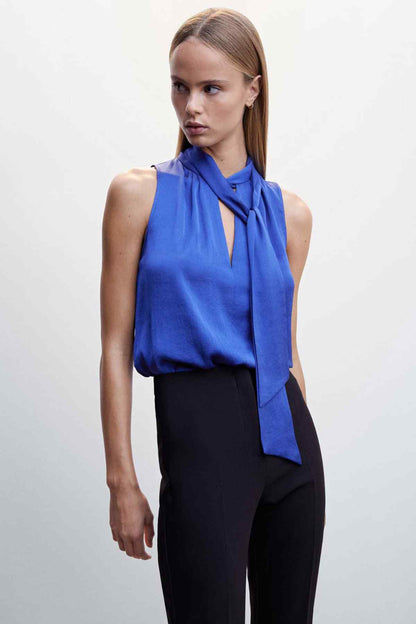 Blue sleeveless blouse with neck tie detail and high collar
