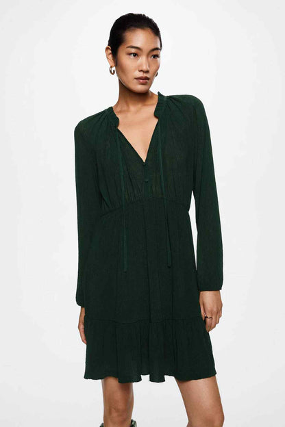 Dark green long-sleeve V-neck smocked waist mini dress with ruffled hem