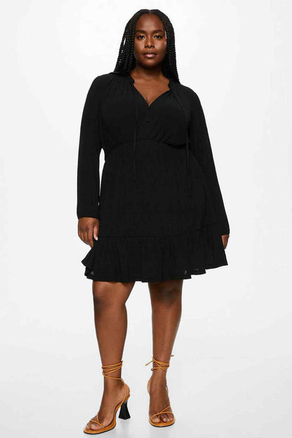 Black long-sleeve V-neck mini dress with button front and elastic waist tiers