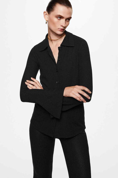 Black knit button-up jacket with pointed collar and long sleeves, front button placket