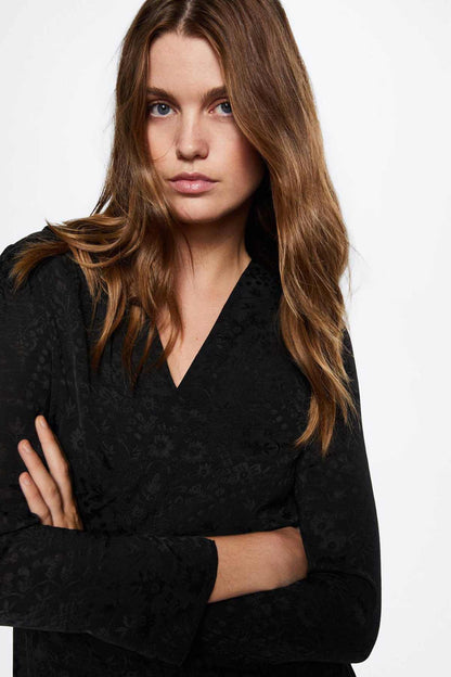 Black V-neck wrap midi dress close-up with long sleeves and draped waist
