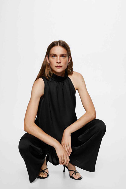 Black sleeveless high-neck blouse with gathered collar and flowy drape