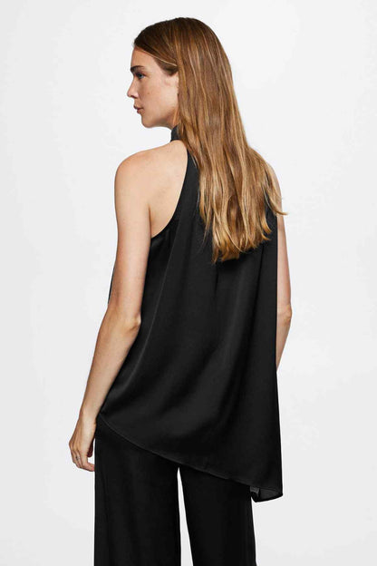 Black sleeveless high-neck blouse, side view with asymmetric draped hem