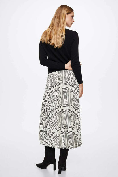 Pleated midi skirt with black geometric line pattern on white, A-line