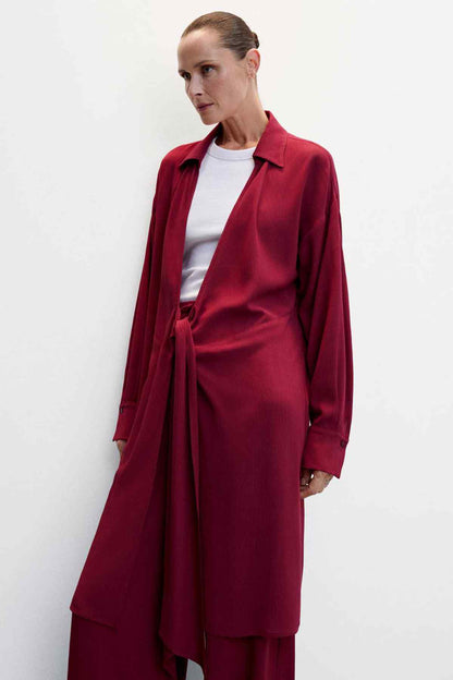 Women’s deep red long blazer with tie at waist and notched lapels