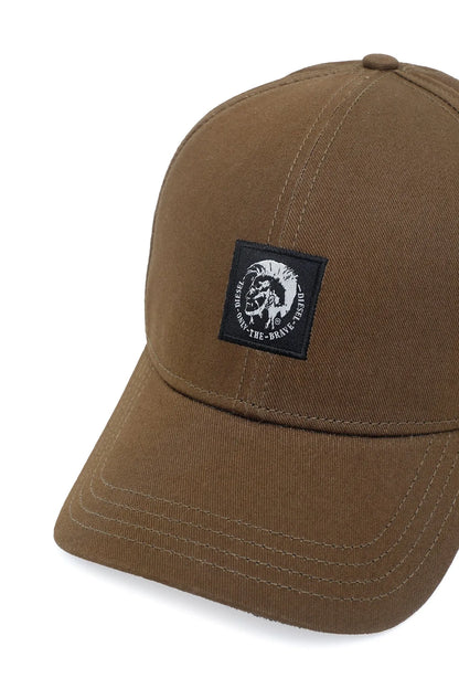 Diesel brown cap close-up with black square logo patch
