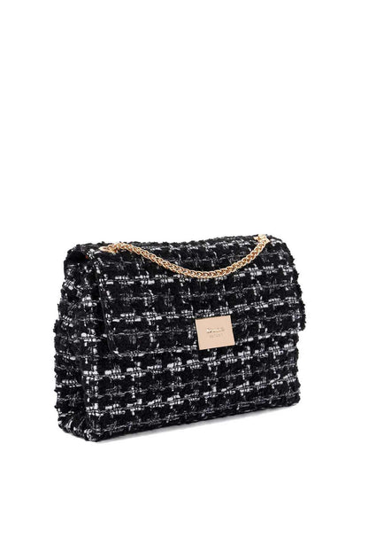 Black tweed-style handbag with white fleck pattern and gold chain strap, front view