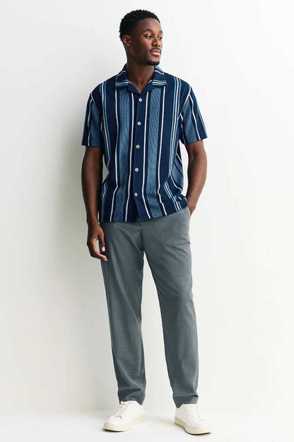 NEXT men’s navy vertical striped short-sleeve button-up shirt, worn with gray pants