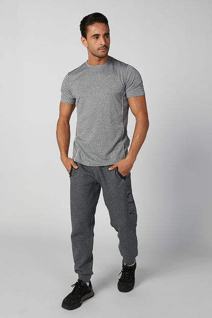 Grey short-sleeve crewneck T-shirt with dark jogger pants