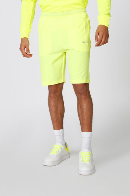 Green athletic shorts with drawstring waist, above-knee length