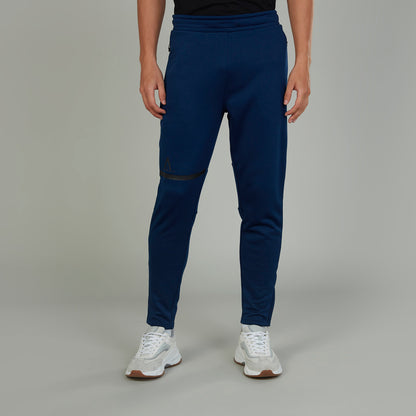 Men's blue jogger pants with contrast panel at thighs and slim tapered legs