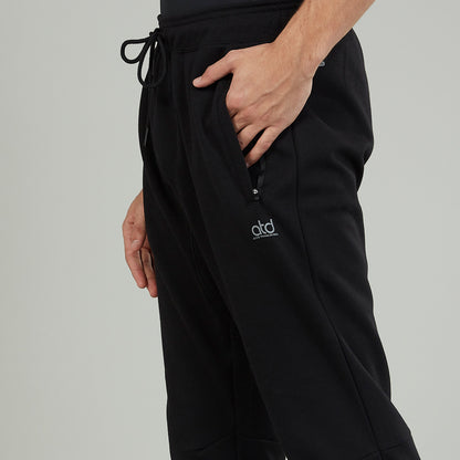 Black jogger pants with drawstring waist and side logo