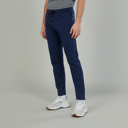 Men's navy jogger pants with adjustable drawstring and tapered fit