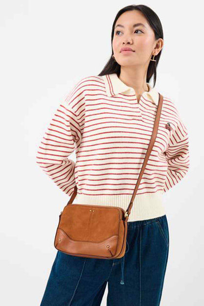 Tan crossbody bag with front pocket and adjustable shoulder strap