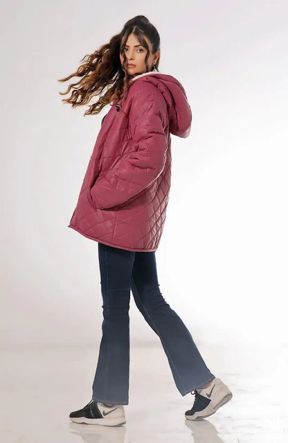 Burgundy quilted hooded jacket with sherpa lining and zip front, side view.